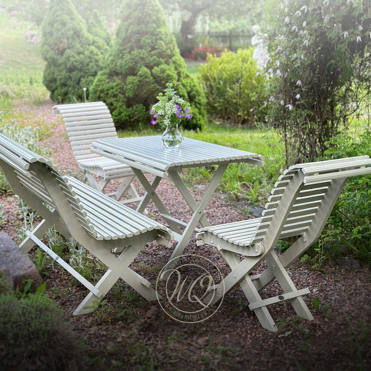 White Sundborn garden furniture set with wooden table and seating